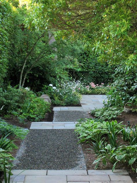This pretty pathway is achieved with simple stone pavers, placed meticulously in rows of three. 15 Eye-Catching Garden Path Ideas With Stepping Stones - The ART in LIFE