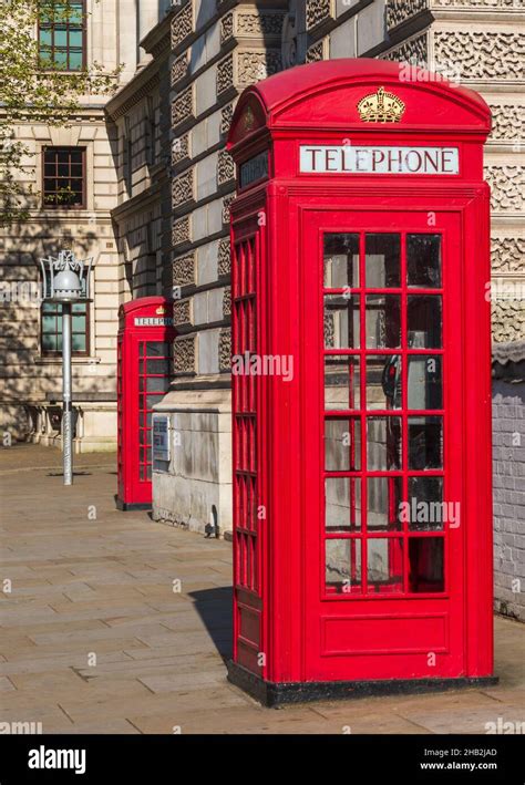 Traditional Red Telephone Kiosks On The Streets Of London England Uk