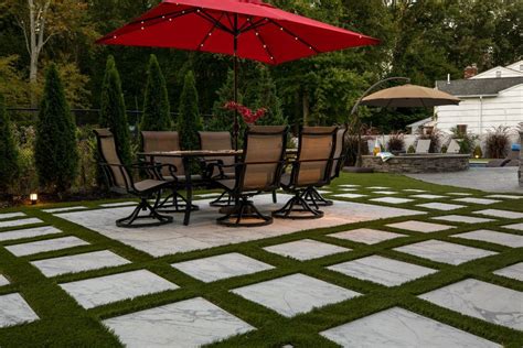 See how to install archatrak 2cm porcelain pavers directly over grass in lawns or other grassed areas as stepping stones or general landscaping. Grass tech fills in the gaps: Synthetic turf and patio pavers | Paver patio, Patio pavers design ...