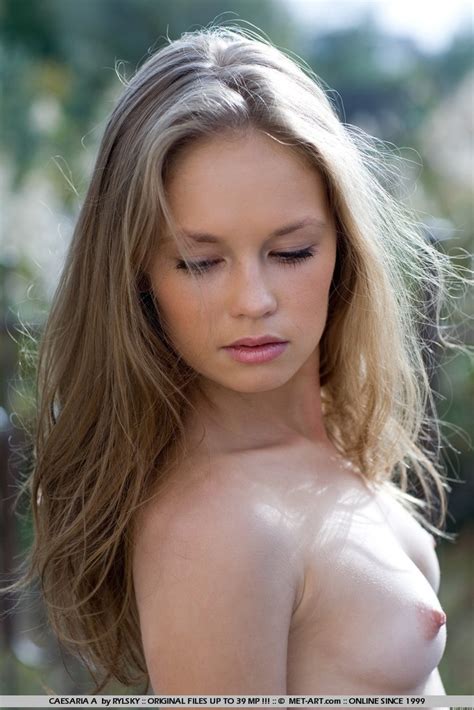 Captivating Teen Caesaria Poses And Plays Nude Outdoors By Met Art
