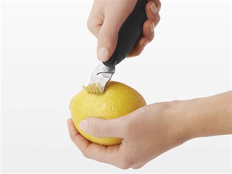 Take your vegetable peeler or paring knife and cut a piece of yellow skin off of the lemon. How to zest a lemon and the tools you need to do it - Business Insider