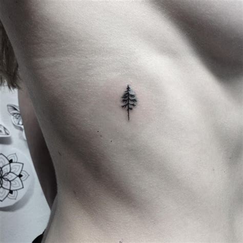 Small flower tattoos celebrate the idea that small is beautiful. tiny tanne for carina #tanne #tree #firtree #nature # ...