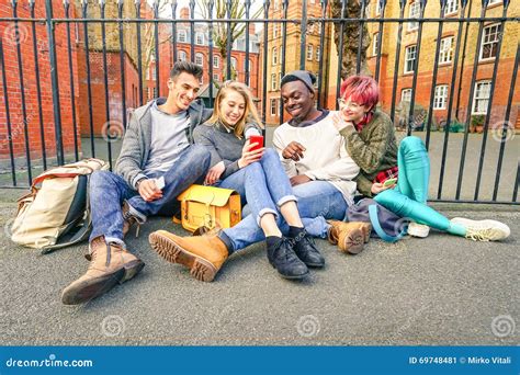 Group Of Happy Multiracial Best Friends Having Fun Using Phone Stock Image Image Of Multi
