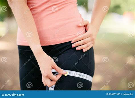 Woman Measuring Her Thigh With Measure Tape Stock Photo Image Of