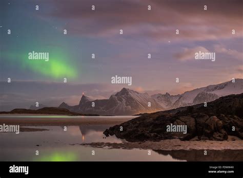 The Aurora Borealis Northern Lights Dancing In Fredvang Lofoten