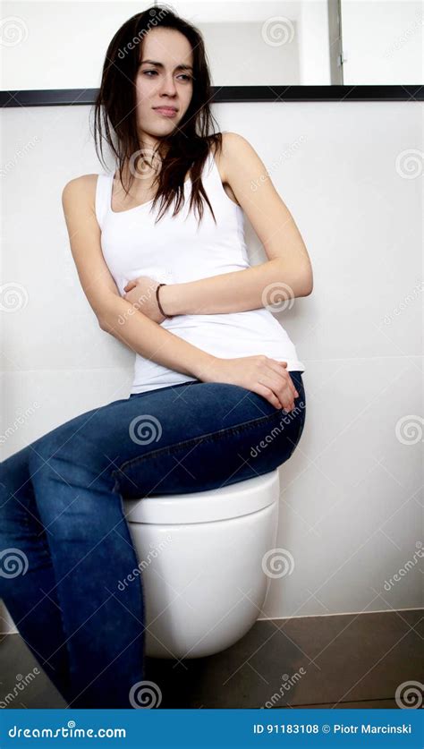 Babe Woman Sitting On Toilet In Public Bathroom Portrait