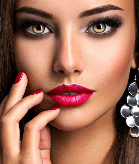 Seductive Woman With Dark Brown Eye Makeup And Bright Red Lips And