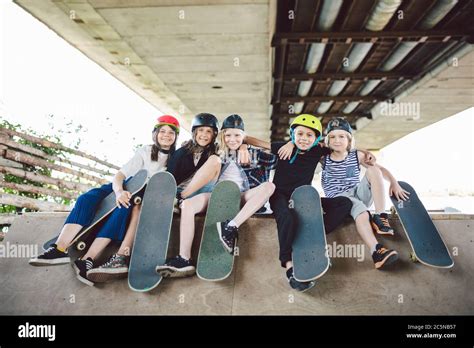 Group Of Friends Children At Skate Ramp Portrait Of Confident Early