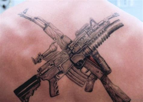 64 Ultra Modern Gun Tattoos For Back Tattoo Designs