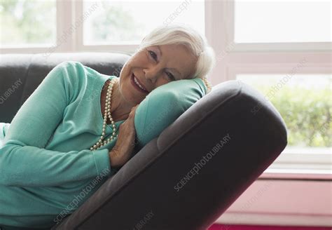 Carefree Senior Woman Relaxing On Lounge Chair Stock Image F Science Photo Library