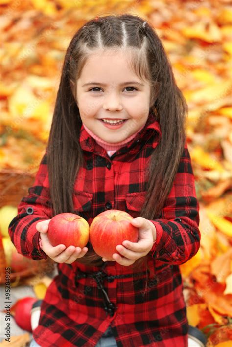 Beautiful Little Girl Holding Apples Outdoor Stock Photo Adobe Stock