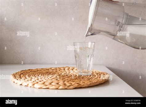 Pouring Water From Pitcher Into A Glass Stock Photo Alamy