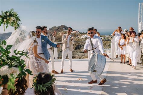 An All-White Wedding Set Against The Santorini Sunset - Wedded Wonderland