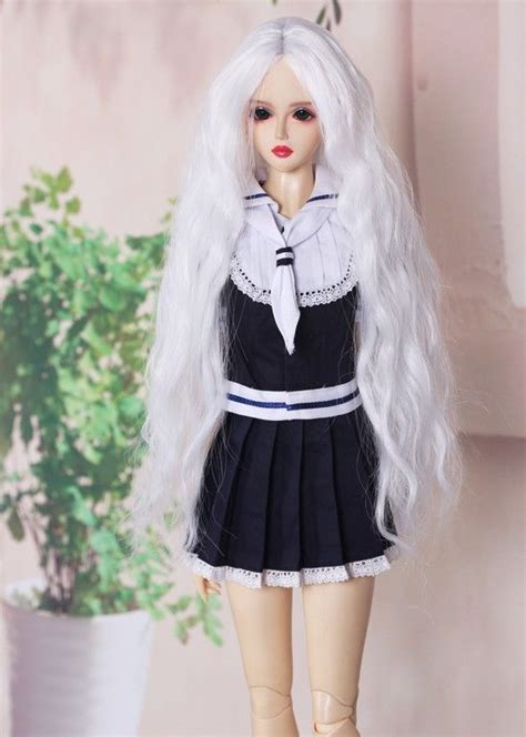 A Doll With Long White Hair Wearing A Black Dress