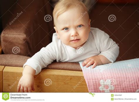 Infant Child Sits On The Sofa Stock Image Image Of Small Young