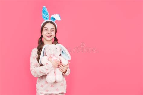 Happy Easter Teen Girl In Bunny Rabbit Ears And Pajamas Play With Toy