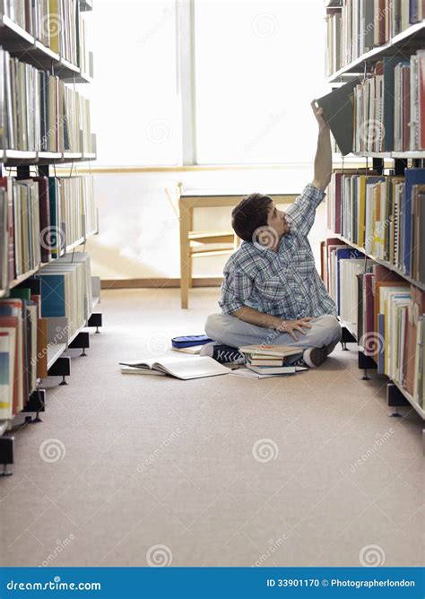 Student Reaching For Book In Library Stock Photo Image 33901170