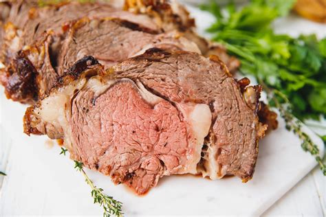 This prime rib roast is cooked to a perfect medium rare, and smothered in a compound butter spiced with chili powder, cumin, fresh herbs, and garlic. Prime Rib Roast Recipe - Cooking LSL