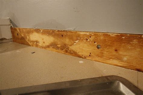 Removing all the cabinet doors and drawers not only makes accessing the inside of the cabinets easier, it allows you to see the screws and nails you need to remove before ripping. How to Remove Laminate Countertop & Backsplash Without Damaging Cabinets | Laminate countertops ...
