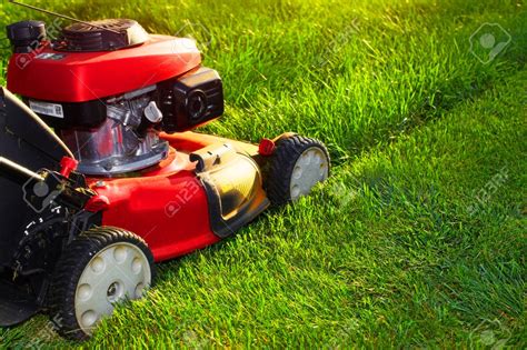 Free Download Red Lawn Mower Over Green Grass Background Stock Photo