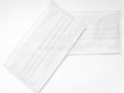 White Surgical Face Mask On White Background Health Care Concept And
