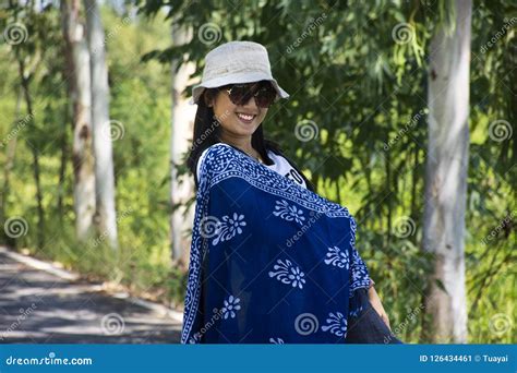 Thai Women Posing Relax And Playing Indigo Tie Dye Fabric Shawl On The Small Street In