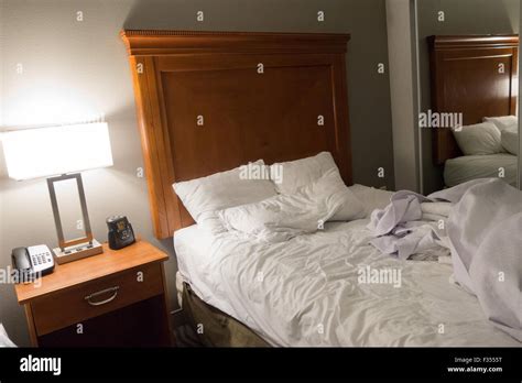 Messy Bed Hotel Room Stock Photo Alamy