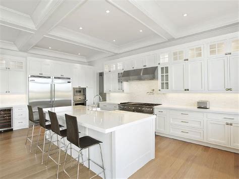 This kitchen island cart is the perfect addition to any kitchen that could use some extra counter space. White Kitchen Island with Dark Wood Barstools - Contemporary - Kitchen