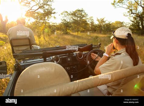 Tracker And Safari Guide On A 4x4 In A South African Game Reserve Stock