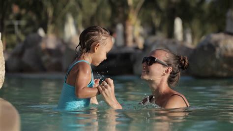 Happy Pretty Mother And Her Daughter Have A Fun In Swimming Pool Stock Video Footage 00 09 Sbv