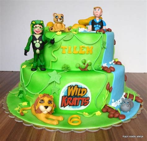 A Birthday Cake Decorated With Cartoon Characters And Animals On The