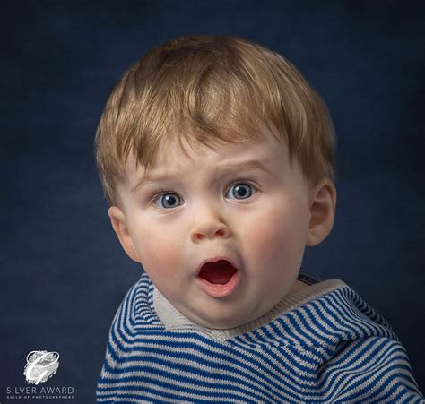 studio-portrait-of-a-super-cute-little-boy-with-a-shocked-expression-by ...