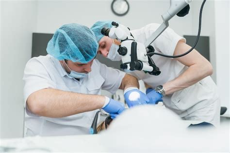 Premium Photo Doctor Used Microscope Dentist Is Treating Patient In
