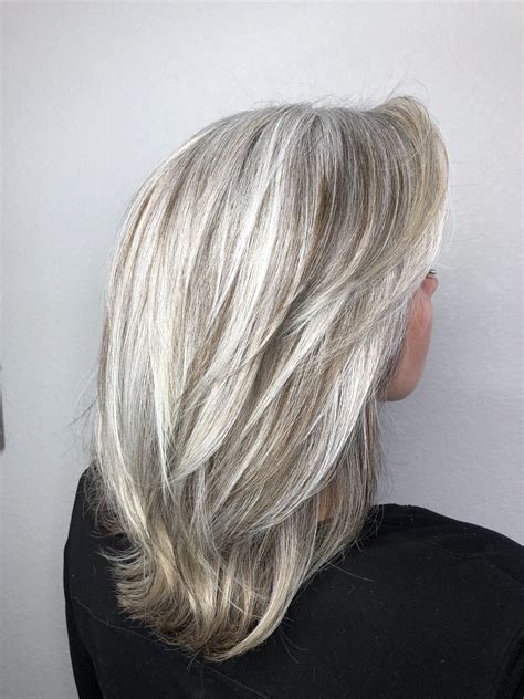 By now, you likely know that silver hair is a serious trend. Transitioning to grey | Gray hair highlights, Grey hair ...
