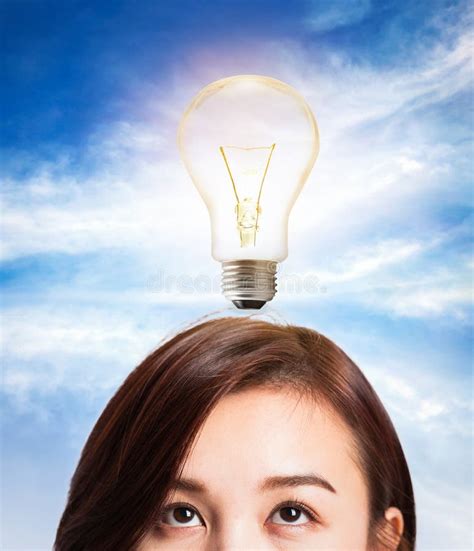 Woman Thinking Idea With Light Bulb On Her S Head Stock Image Image