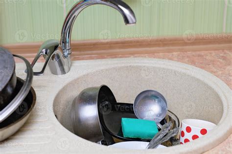 Dirty Dishes And Kitchen Utensils In A Sink Messy Kitchen Cluttered