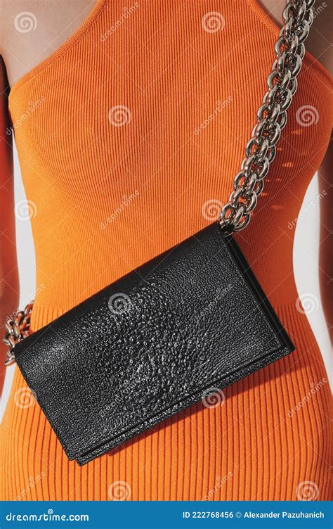 Girl In Orange Dress With Black Leather Handbag Stock Photo Image Of