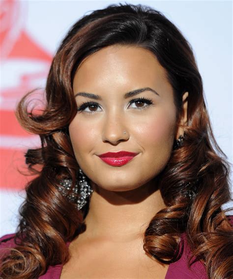 Demi Lovato Long Curly Black Hairstyle With Side Swept Bangs And Brunette Highlights