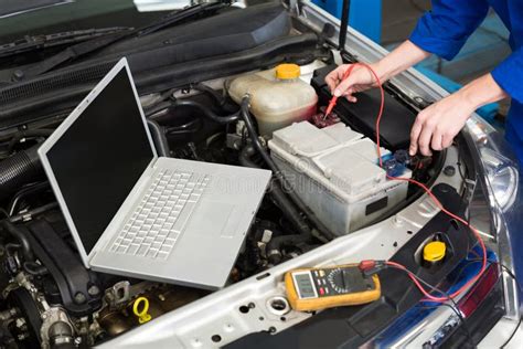 Mechanic Using Diagnostic Tool On Engine Stock Photo Image Of Auto