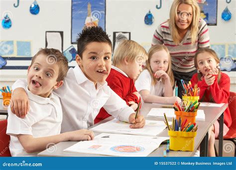 Primary Schoolchildren And Teacher Working Stock Photo Image Of Grade