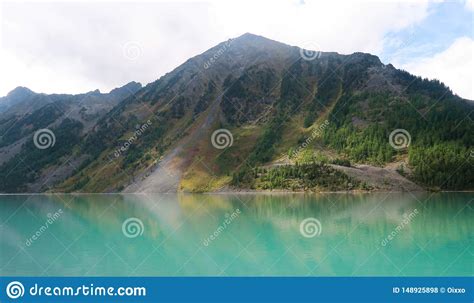 Beautiful Blue Kucherla Lake Reflection Of Mountains In The Water
