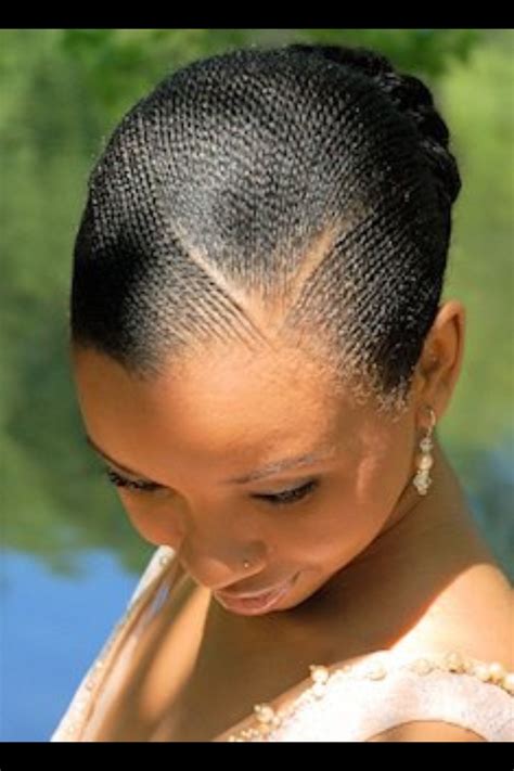 Braiding looks so neat and tidy and there are so many variations on how to do a standard braid. Small flat twists in a bun. | African hair braiding ...