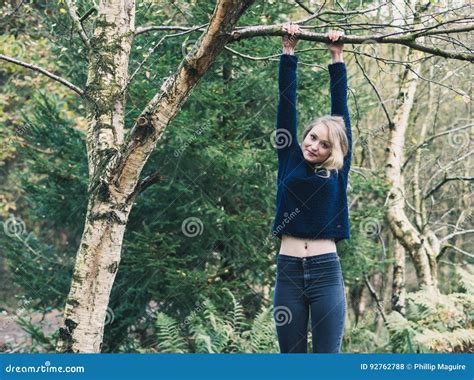 Young Woman Holding Onto Tree Stock Photo Image Of Woods Fall 92762788