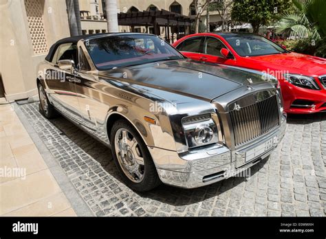 Chrome Plated Rolls Royce Luxury Car Parked Outside Hotel In Dubai