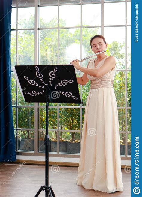 Asian Woman Blowing The Flute Stock Photo Image Of Classical