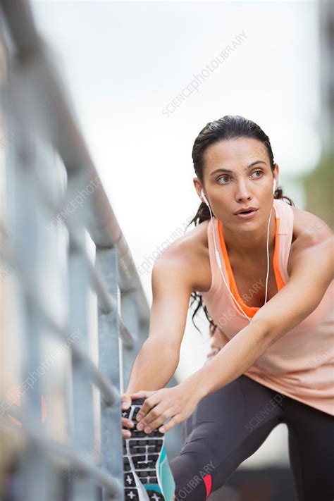 Woman Stretching Her Legs Before Exercise Stock Image F