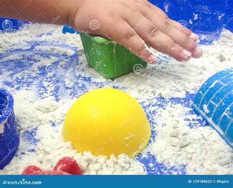 Little Girl Playing With Magic Motion Sand Stock Image Image Of