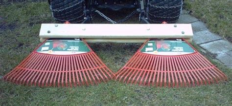 A piece of wood can be attached to your rake to make a simple garden leveller to be used when top dressing your lawn. Diy Lawn Leveling Rake