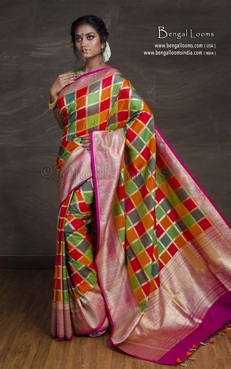Banarasi sarees are weaved with a blend of superior quality cotton and fine threads of silk. Semi Katan Checks Banarasi Saree in Red, Magenta and Green ...
