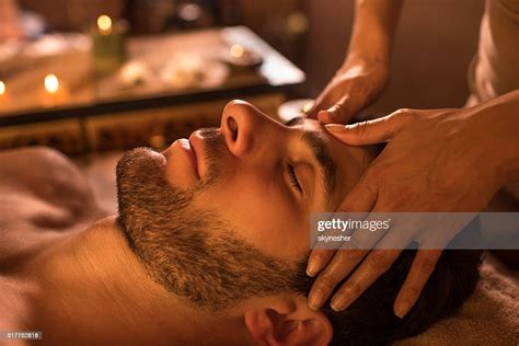 Closeup Of A Man Receiving Facial Massage At The Spa High Res Stock